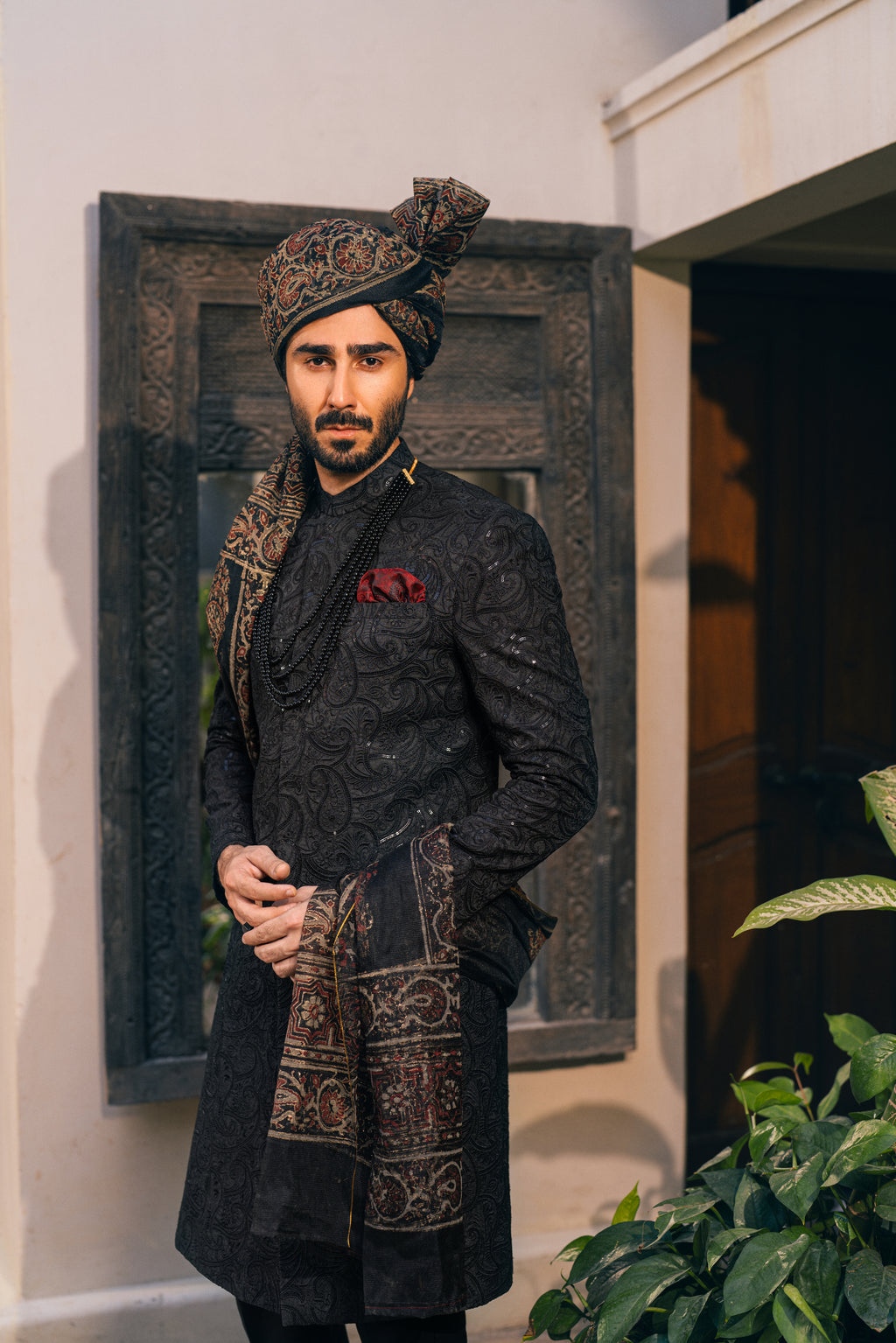 Black Sherwani adorned with self-embroidery humyaunalamgir