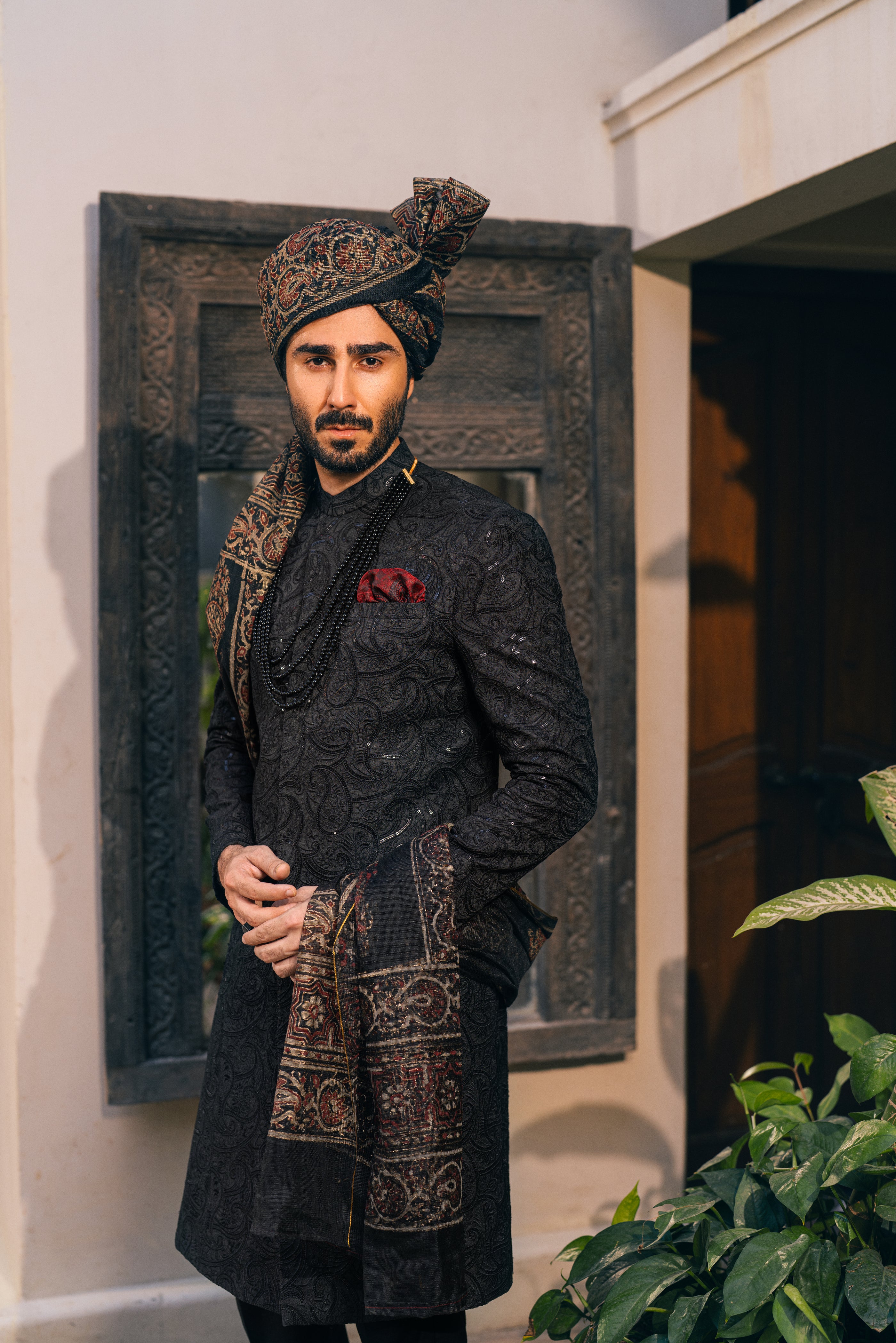 Black Sherwani adorned with self-embroidery humyaunalamgir