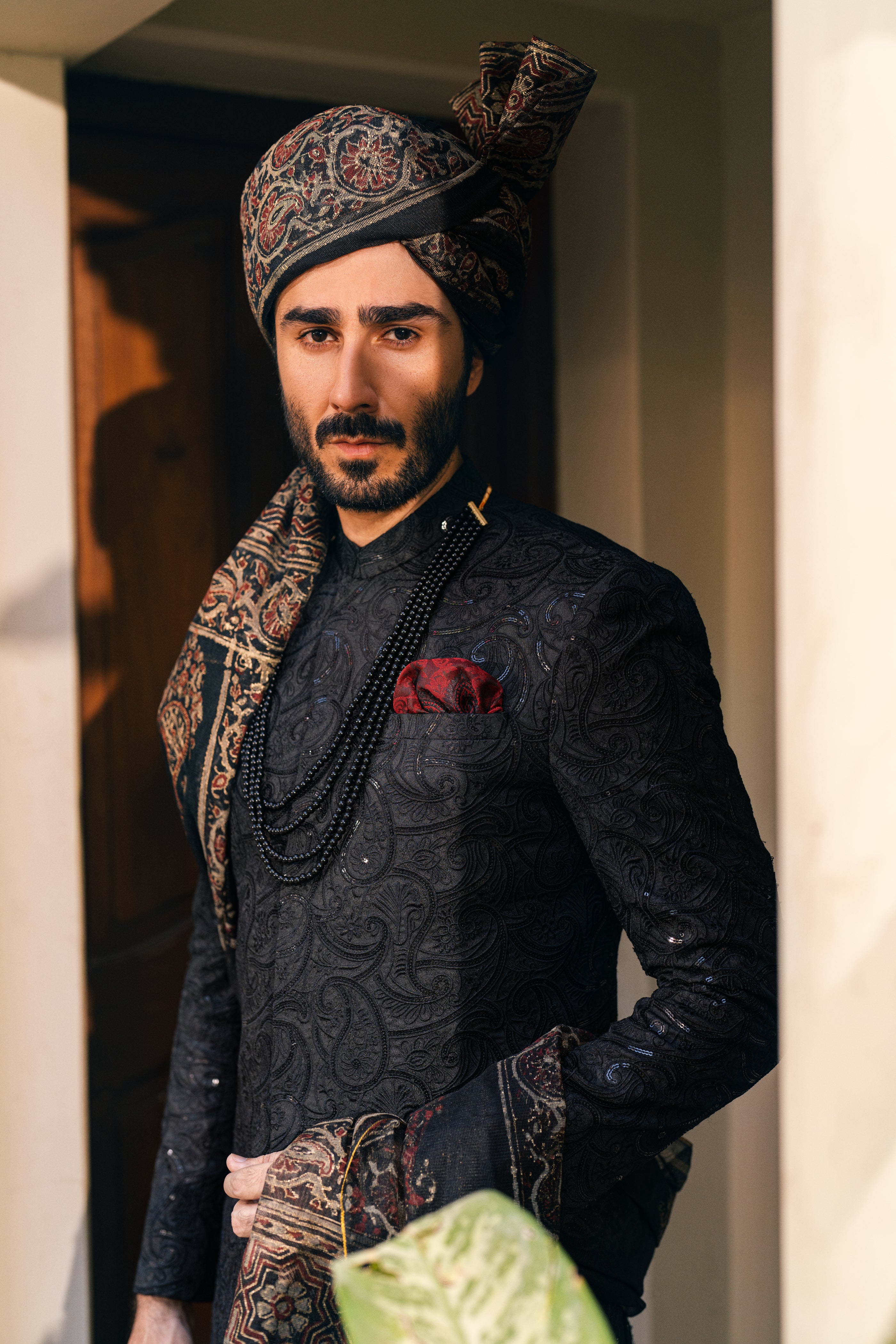 Black Sherwani adorned with self-embroidery humyaunalamgir