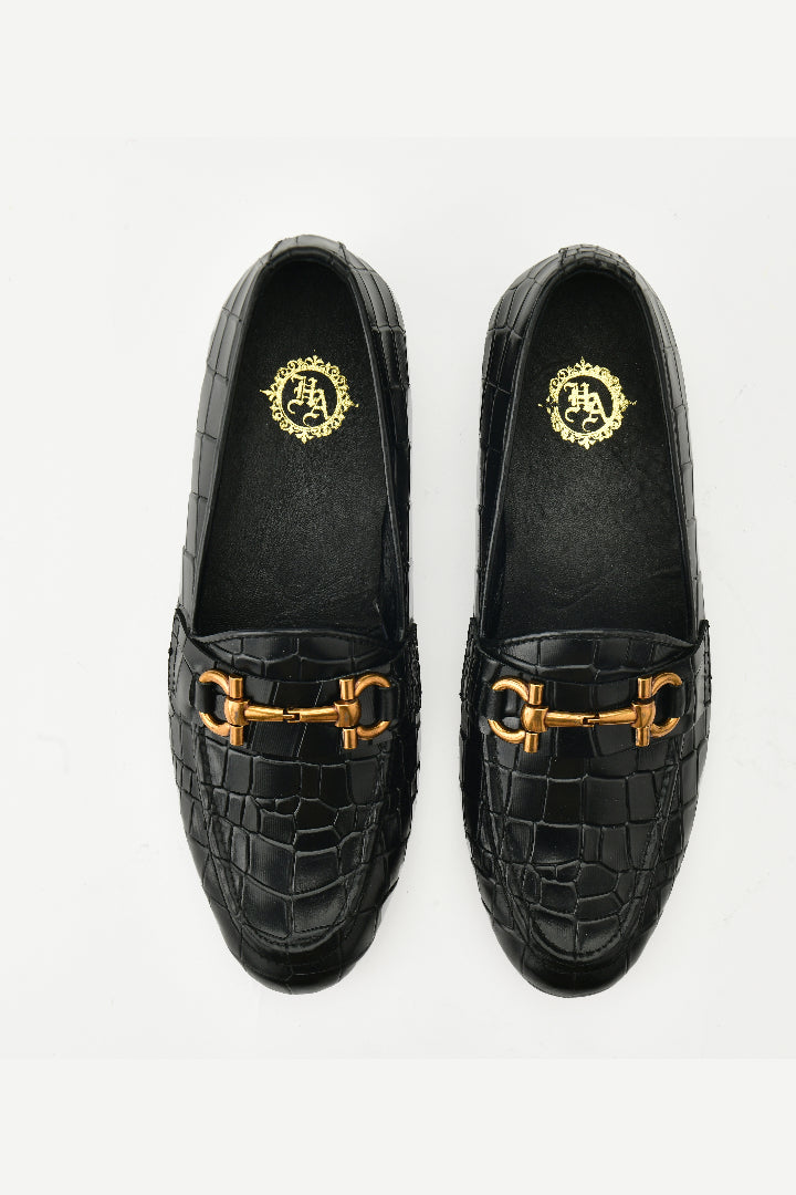 Black Gucci buckle shoes